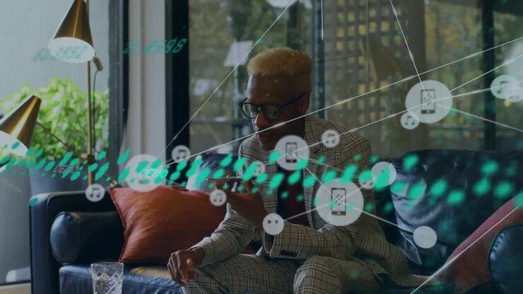 Animation of media icons over african american businessman in office