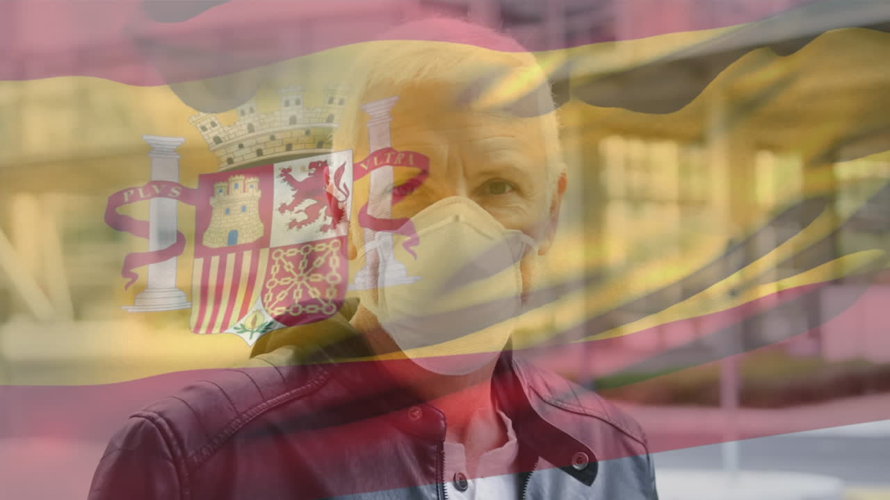 코로나 19 대유행 기간 동안 마스크를 쓰고 있는 남자 위에 흔들리는 스페인 국기의 애니메이션