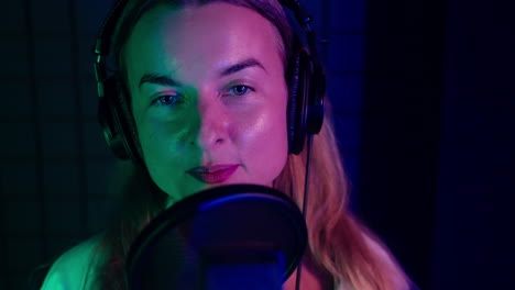 woman singing in recording studio