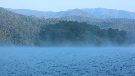 foggy river with mountains in chiang mai, thailand