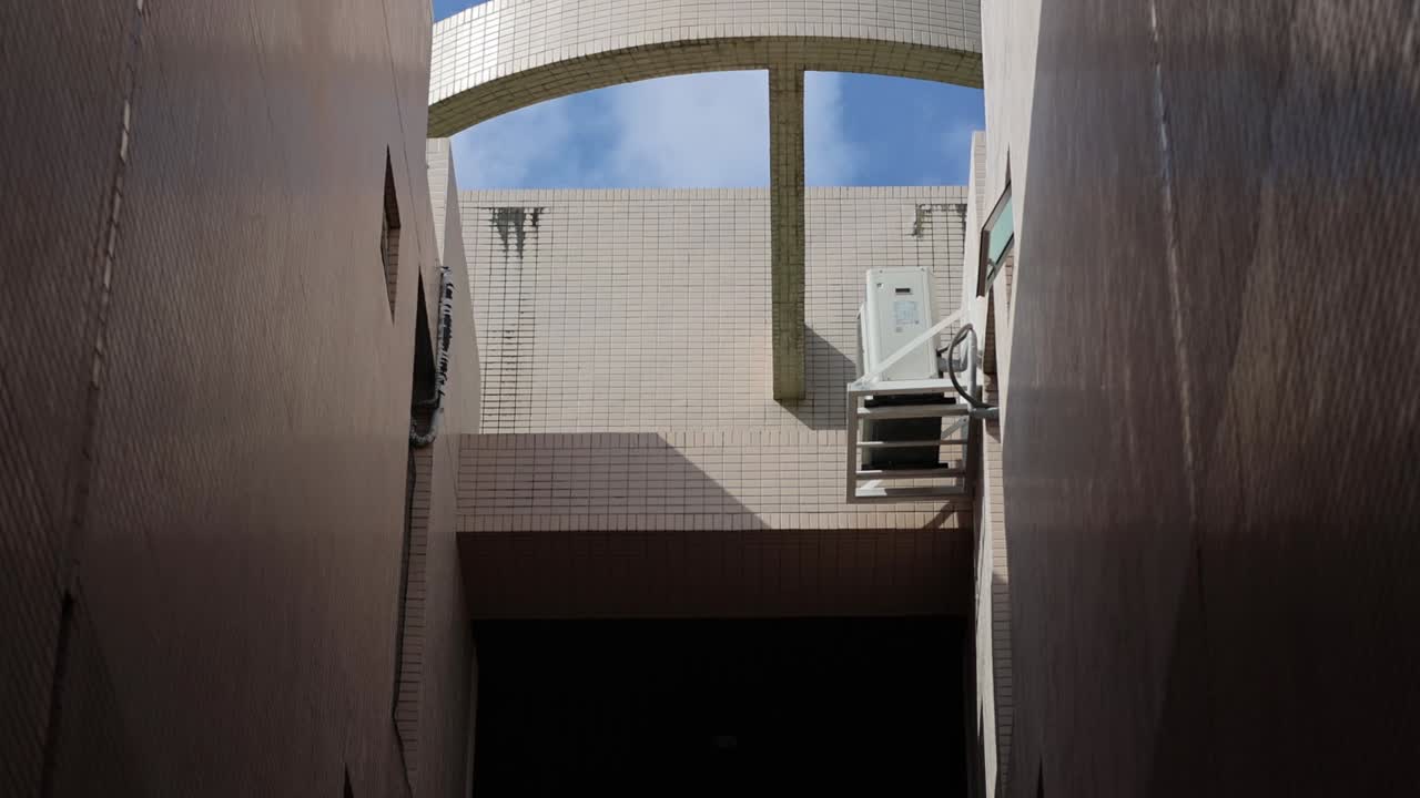 Sequential views of a building's exterior architecture