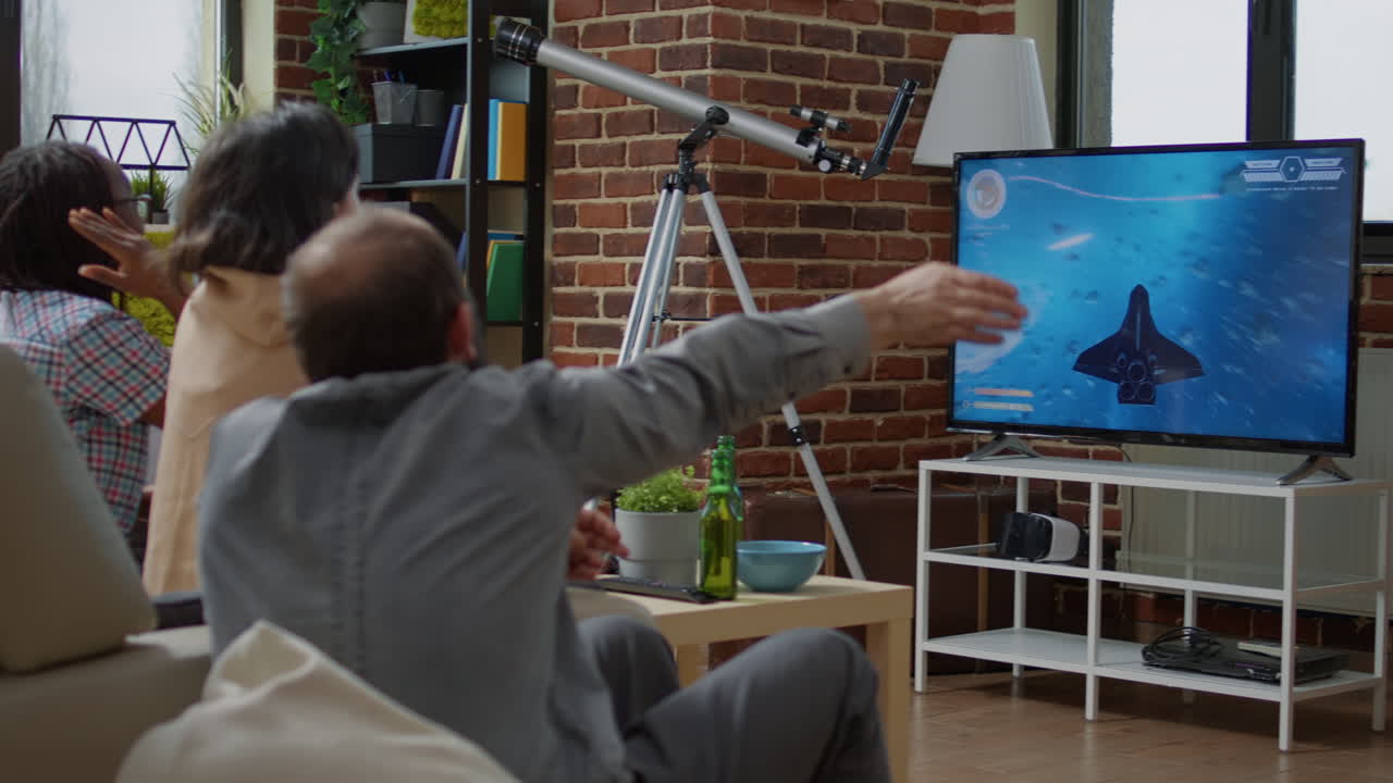 Diverse group of friends playing video games on television