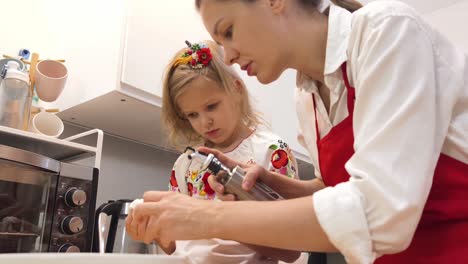 mother and daughter baking together