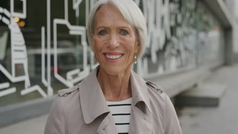 portrait-of-elderly-woman-smiling-happy-looking-at-camera-enjoying-vibrant-urban-city-lifestyle-senior-business-woman