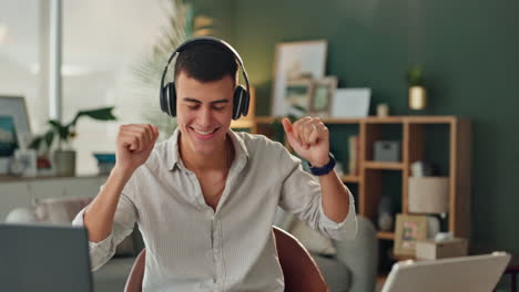 man dancing at home with headphones