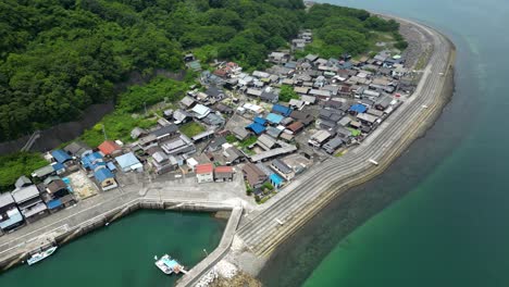 typical japanese port town with on small rural island, slow motion drone shot
