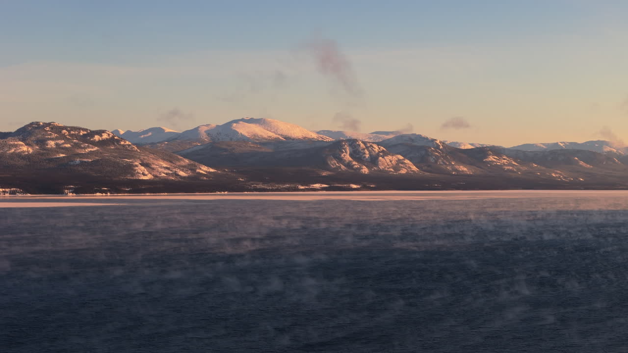 Sunrise Glow Over Mountains In Lake Laberge, Yukon Canada. Aerial Shot