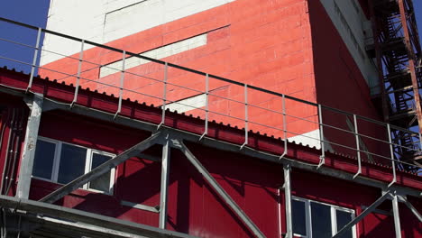 industrial building exterior with metal structures and walkways