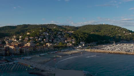 drone shot revealing the city of andora, liguria