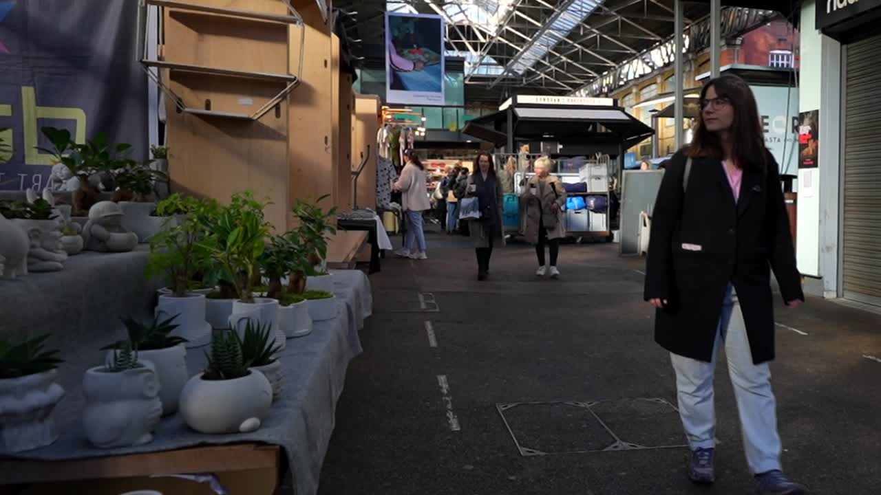 People walking on the Old Spitalfields Market in London