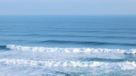 ocean waves crashing on the shore