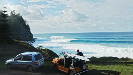 a jeep with surfboards by the norfolk coastline, ready for surf exploration