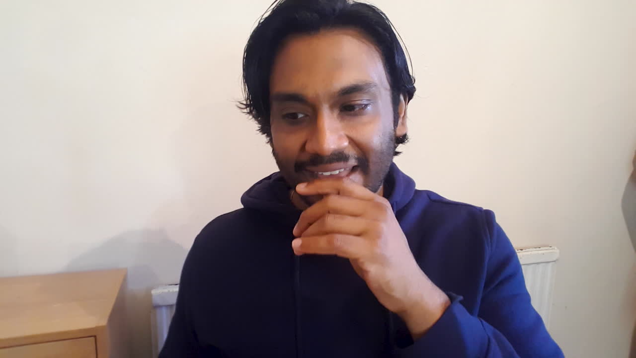 Young Man On Video Call Telling Story to Friends Directly to Camera