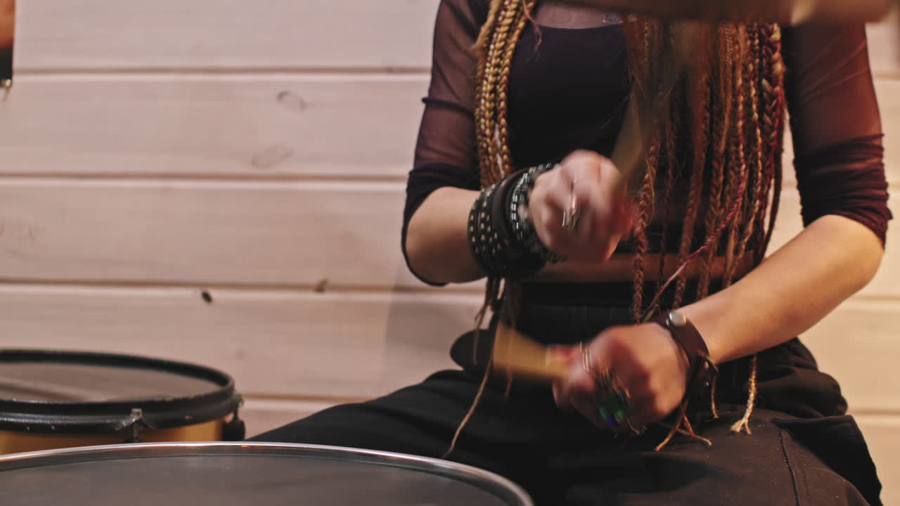 Rock-and-Roll Female Drummer Playing Drums