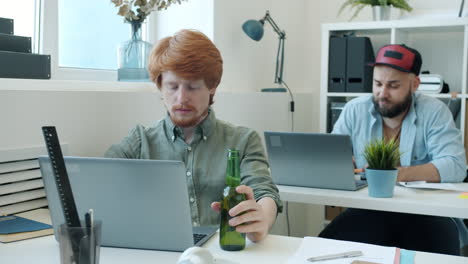office workers working and drinking beer