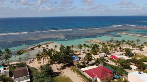 drone sequence of white sand beach with beautiful water colour in guadeloupe