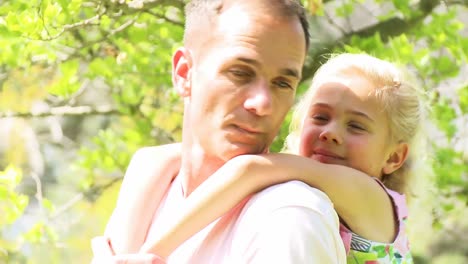 father giving little girl piggyback ride