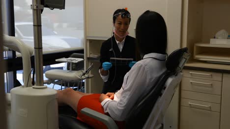 female dentist interacting with a patient 4k