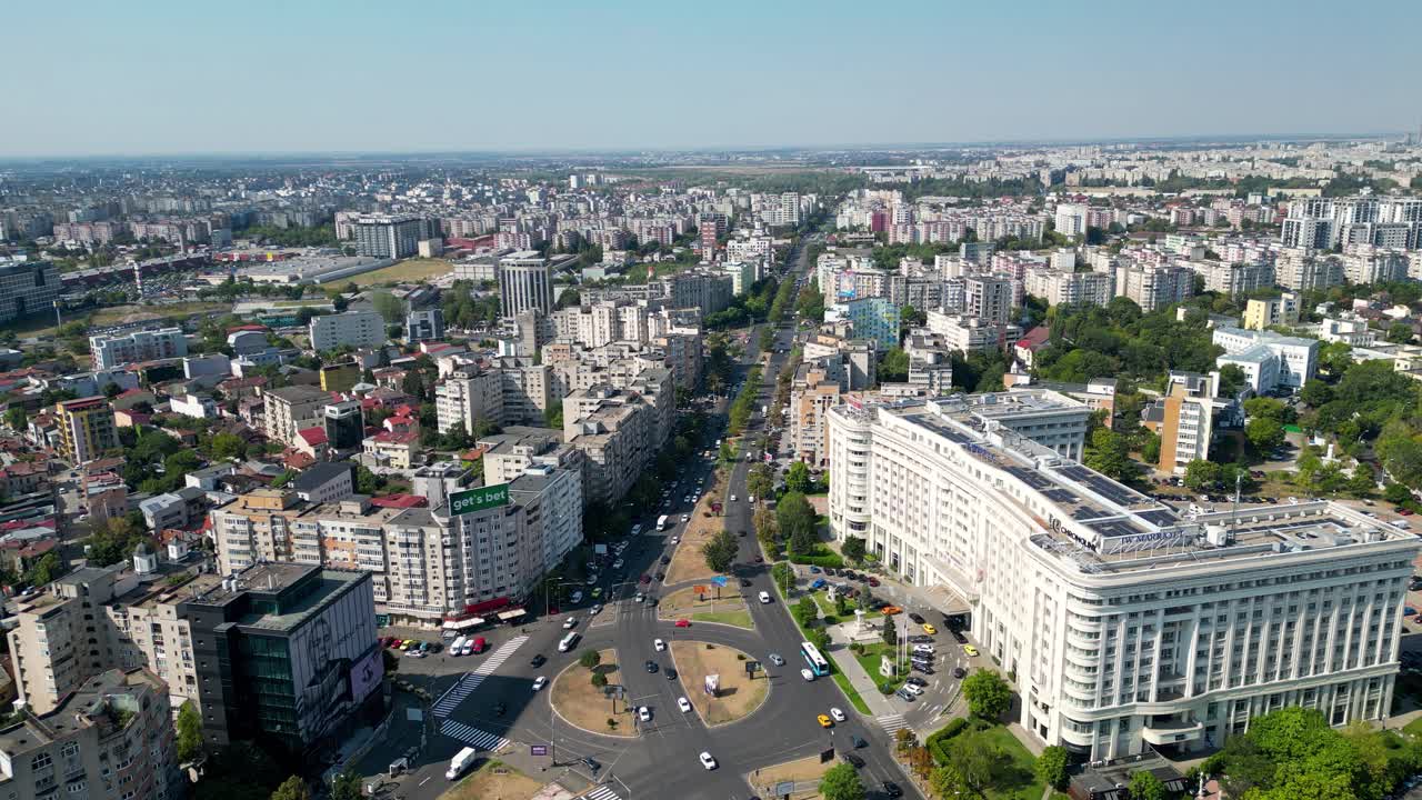 City center of Bucharest, perspective from above. Viev of 13 September Street and famous JW Marriot Hotel on the right side. Static footage. Bussy road, traffic of capital city.