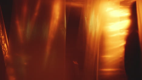 plastic curtains fluttering in dark studio with neon illumination
