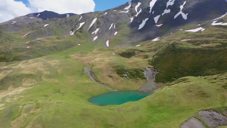 cinematic wide rising drone shot of oreit lake in tusheti georgia, in the caucasus mountains