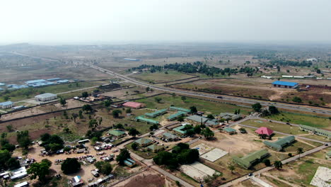 a suburb of the city of keffi in the nasarawa stie in nigeria along the keffi-akwanga expressway - aerial flyover