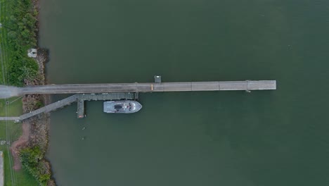 Birdseye-view-of-small-boat-docked-at-port