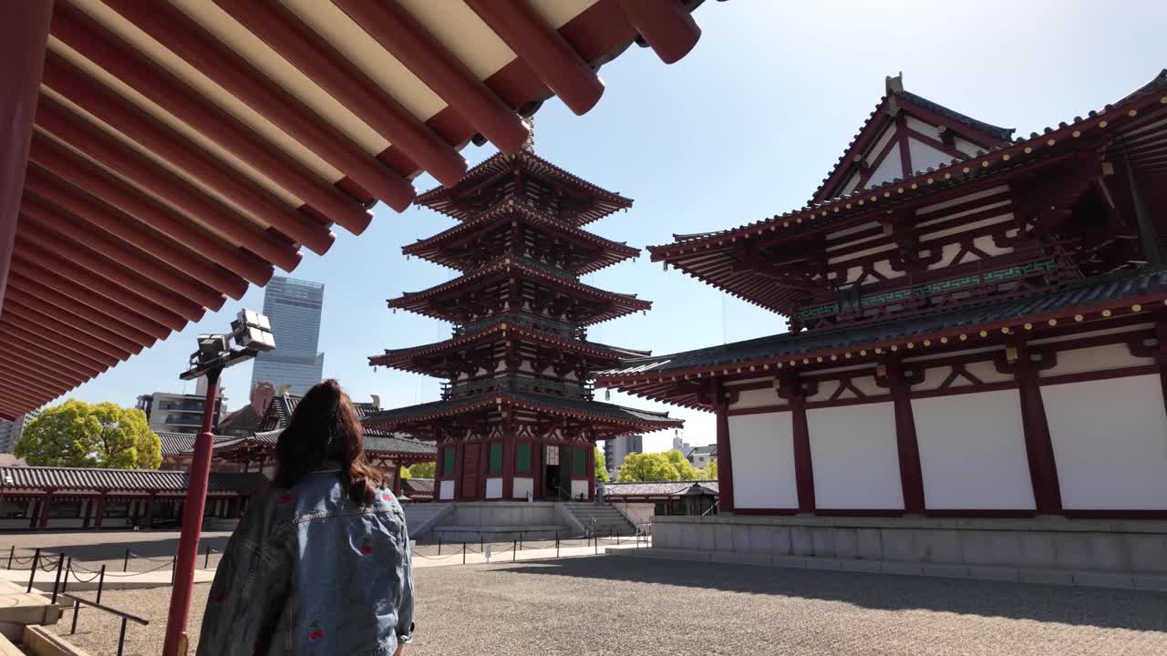 Tourist visiting Shitennoji shrine buddhist temple complex Osaka Japan