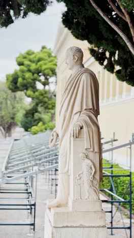 ancient statue beside zappeion hall with courtyard view