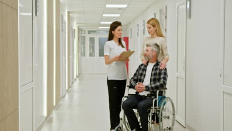 hospital consultation with patient in wheelchair