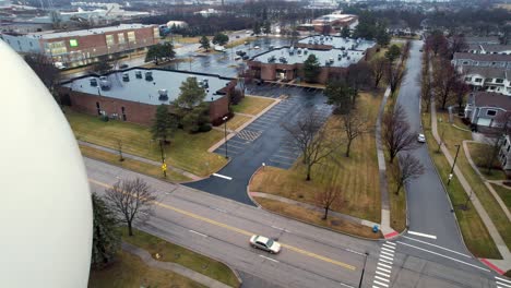 aerial of vernon hills water tower with vernon hills logo at the intersection hawthorn pkwy and west end ct 4k video