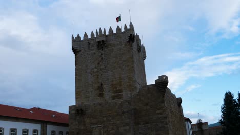 static establishing view of castle tower and flag in chaves vila real portugal