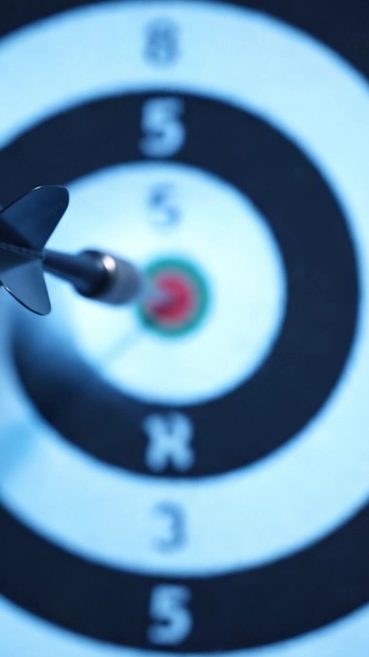 Precision Targeting: The Art of Darts as the Dart Hits the Bullseye in a Dramatic Showdown of Skill and Accuracy