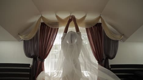 beautiful and lovely bride in night gown and veil. wedding morning. slow motion