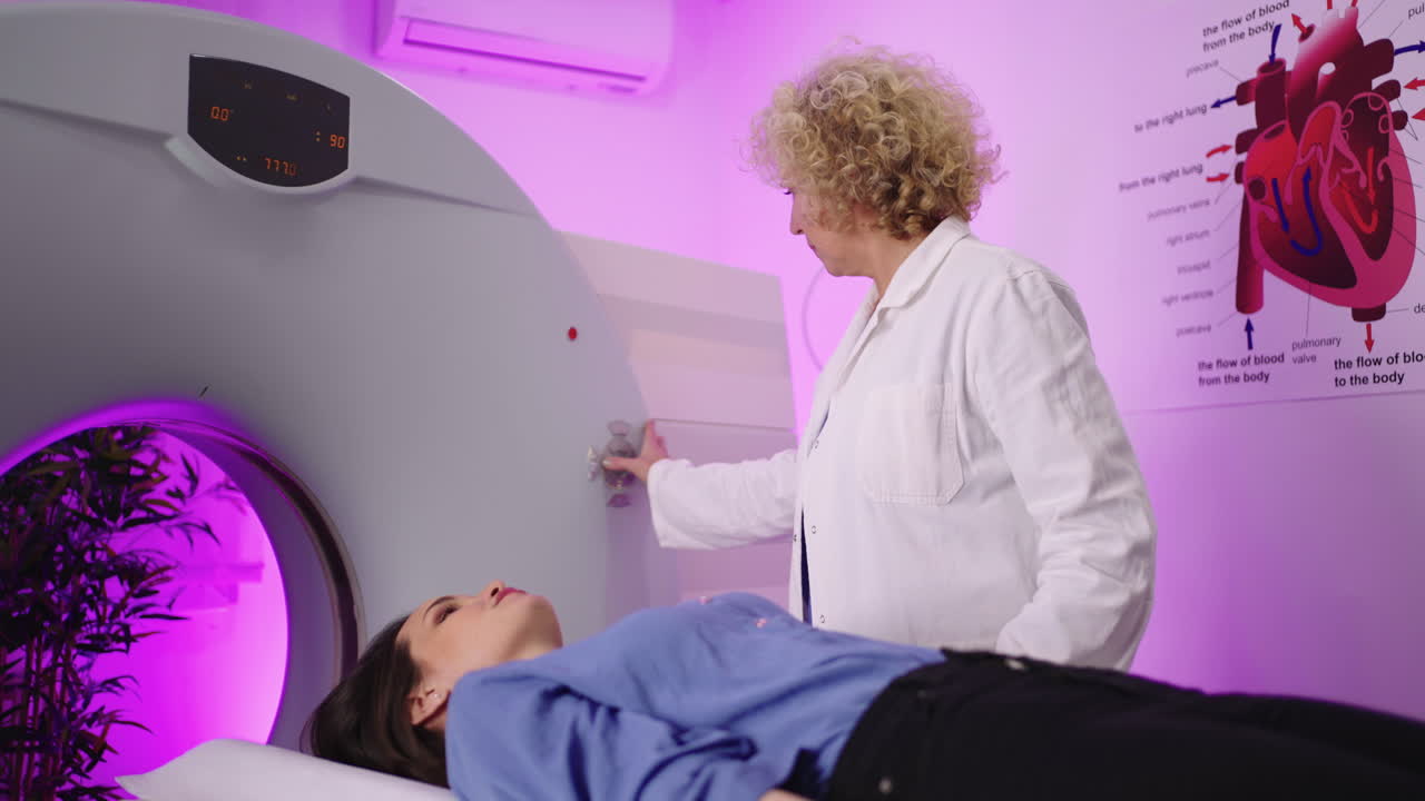 Medical professional preparing a patient for a CT or MRI scan