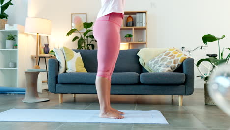 young woman doing yoga exercises at home