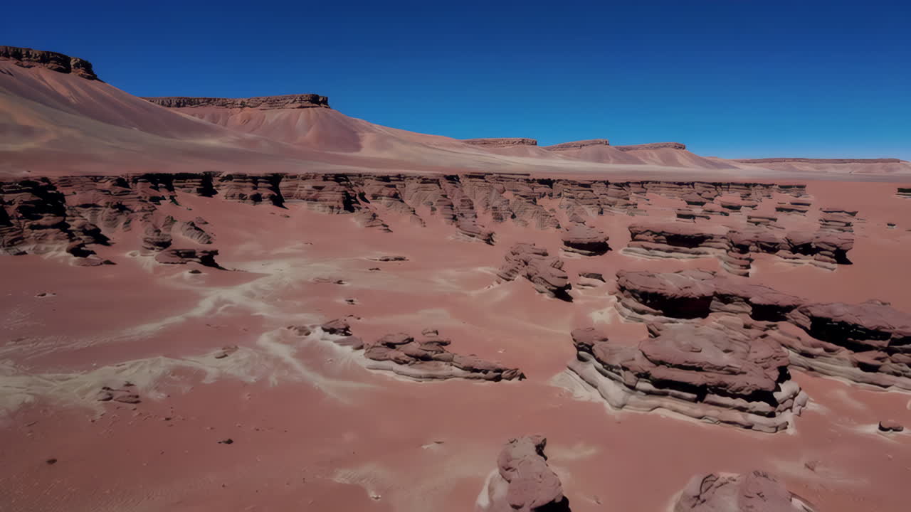 Vast Arid Landscape with Unique Eroded Rock Formations
