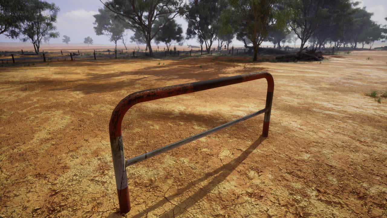 Landscape with metal barrier in rural area under cloudy sky