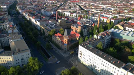 berlin's urban landscape, capturing a mix of residential and commercial buildings, streets, and green spaces. great aerial view flight static tripod hovering drone