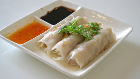 chinese steamed rice noodle rolls with crab - asian food style