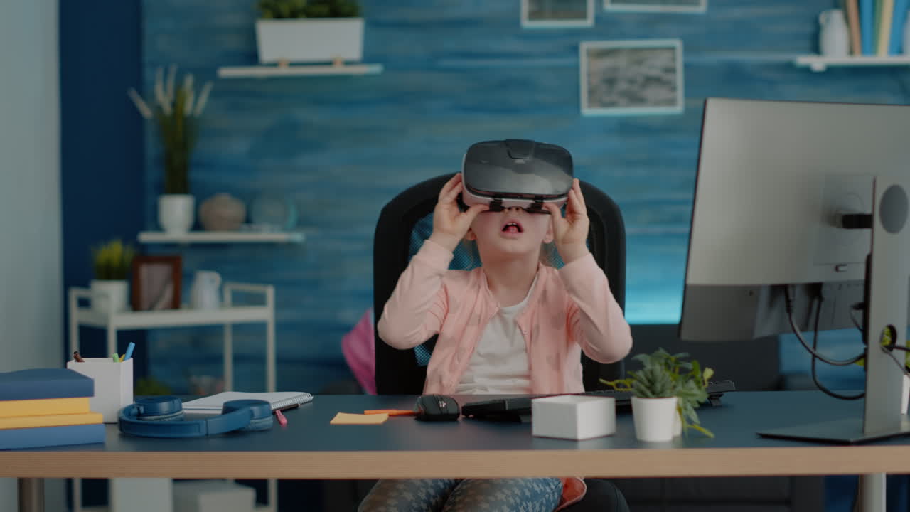 Little child studying with vr glasses for homework and online classes