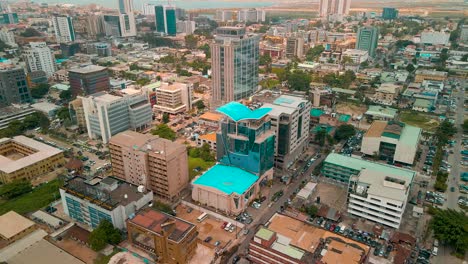 Traffic-and-cityscape-of-Victoria-Island,-Lagos,-Nigeria-featuring-Falomo-Bridge,-Lagos-Law-school-and-the-Civic-centre-tower