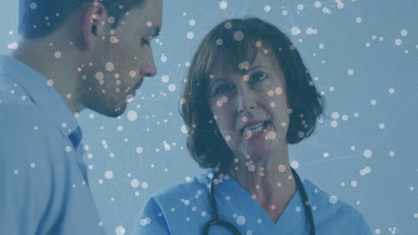 healthcare professionals discussing with network connections overlay in hospital setting