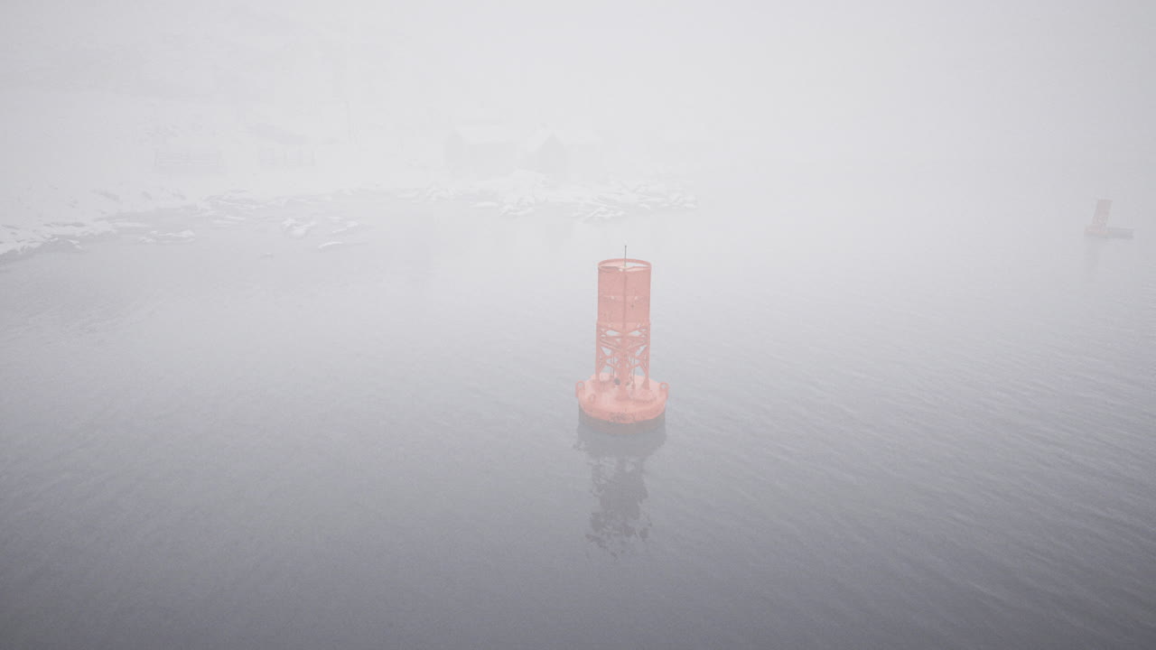 Misty morning on the water with an orange buoy surrounded by fog