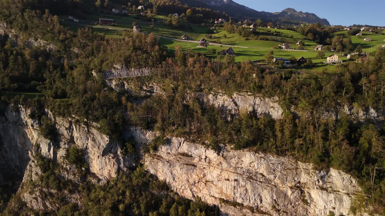 Scenic village at mountain edge cliff drop in Switzerland nature holiday