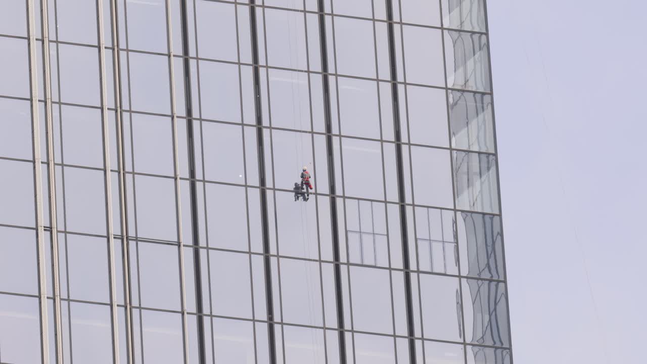 Window Cleaners on a Skyscraper