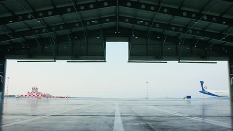 empty airport hangar with airplane