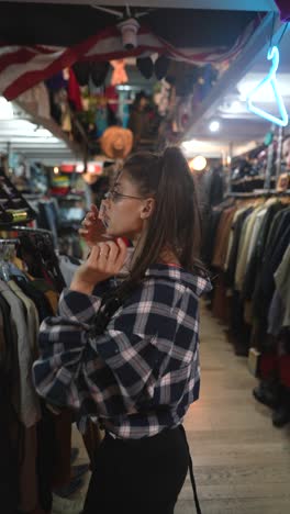 woman browsing in a vintage clothing store