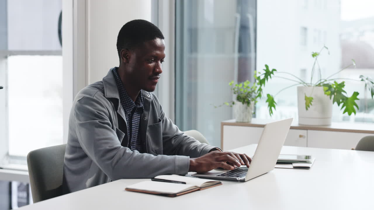 Man working on laptop in office