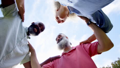 embracing and laughing together outdoors, senior friends enjoying companionship
